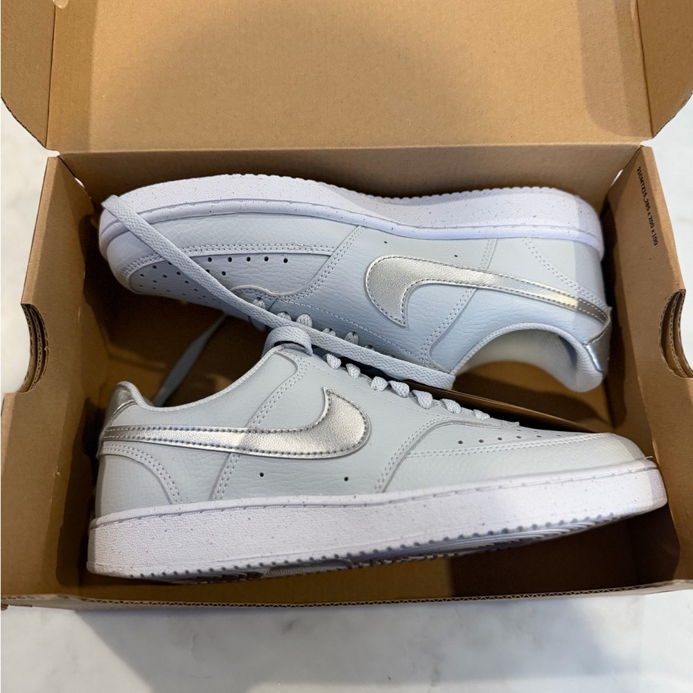 Nike Low-Top Sneakers in Pale Blue with Silver Swoosh